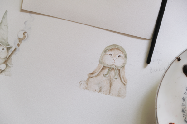 watercolour painting of a grumpy bunny with a headscarf looking like a babushka.